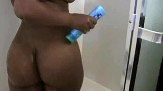 Beautiful ebony woman enjoys a relaxing shower