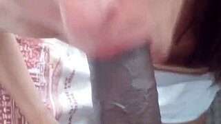 Sofie Marie is giving a POV blowjob to that big black cock.