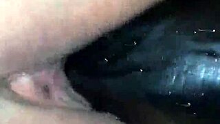 She takes the big dildo deep, fucking herself hard with toys in a casual scene.