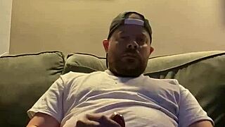 Guy jerks off solo to gay porn videos