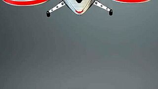 two cute teens playfully using strapon and dildo