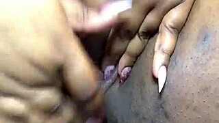 ebony woman masturbates with fingers and squirts