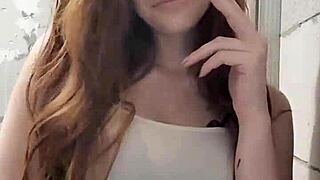 redhead fetish enthusiast lights up a cigarette in a smoky session