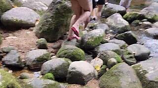 Enjoying a relaxed walk by the waterfall