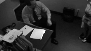 Blonde secretary assists boss at work with handjob