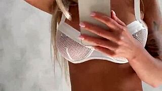 Monika fox poses in front of the mirror before shooting