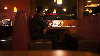 Indian Guy Enjoys American Breakfast in Public Outdoor Setting