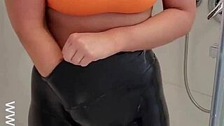 Hot babe teasing in sports bra and leggings! 🚿