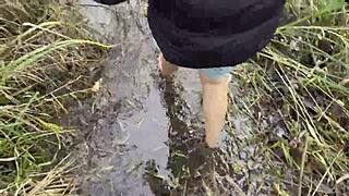 Muddy feet exploration in swampy bog