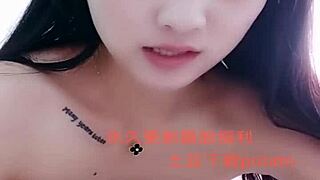 I watch this Asian amateur girl perform a strip show.