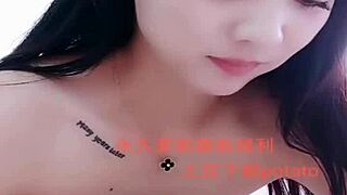 I watch this Asian amateur girl perform a strip show.