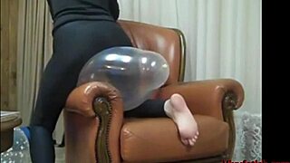 A guy rubs balloons in a fetish grinding session