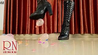 High heels boots pop small balloons in femdom domination close up