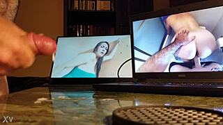 Guy masturbating at his desk with computer