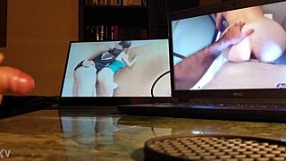 Guy masturbating at his desk with computer