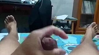 on the bed, masturbating and squirting all over.