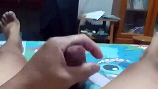 on the bed, masturbating and squirting all over.