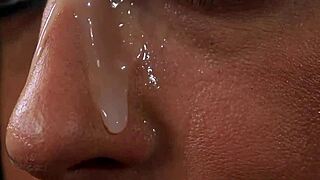 Hot babe receives cumshot on face and eats all ejaculate.