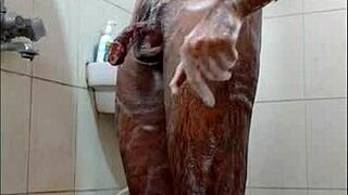 dude jerks off in the shower and shoots his load