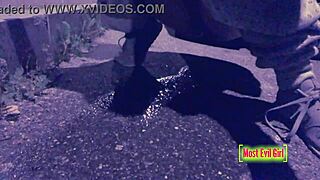 girl alone at night in parking lot lowers pants to piss