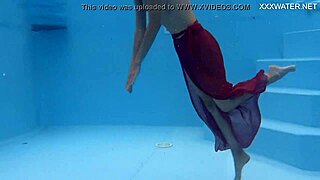 Tiny skinny Hungarian pornstar Hermione Ganger swims in the pool. Her petite brunette frame glides underwater with friends nearby.