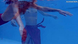 Tiny skinny Hungarian pornstar Hermione Ganger swims in the pool. Her petite brunette frame glides underwater with friends nearby.