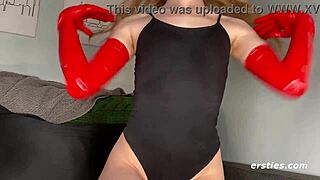 Alice Masturbates to Latex Fetish in Oiled Scene.