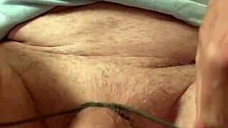 Mature gay man ties his cock and balls. The bdsm session builds intense pleasure.