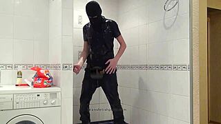 master in blue jeans washing in bathroom