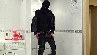 master in blue jeans washing in bathroom