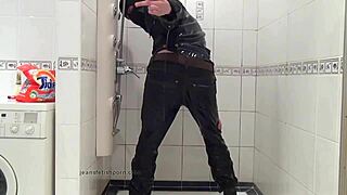 master in blue jeans washing in bathroom