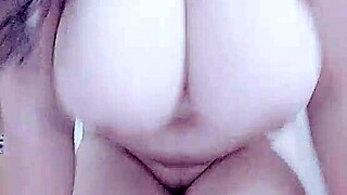 horny layla plays with big tits while fingering pussy in group scene.