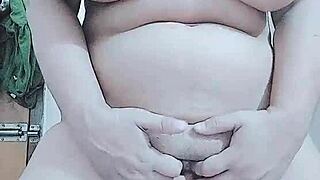 horny layla plays with big tits while fingering pussy in group scene.