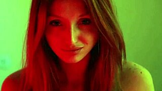 Pretty redhead in stockings and corset whips her ass to orgasm