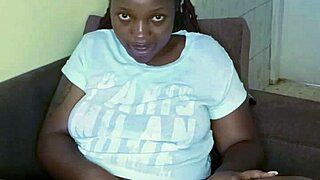 Look at this black babe teasing her pussy with big tits