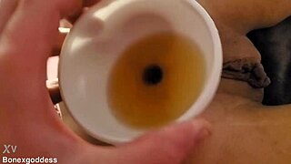 kinky teen allows guy to fill her asshole with piss via funnel