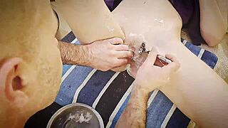 Gently shaving her smooth body