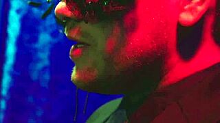 Kelly Madison and Audrey Royal, cum covered and masked, perky tits glistening.