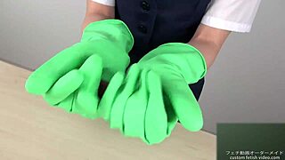asian expert gives a slick handjob using latex gloves.