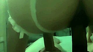 Latina bride stuns in lace lingerie on wedding night.