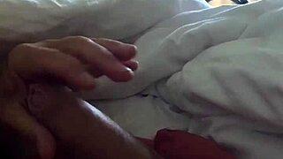 A mature woman gives an early morning handjob.