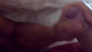 A mature woman gives an early morning handjob.