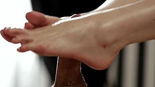 Cute girl gives footjob to big cock