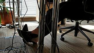 Office worker engages in playful shoe activities during work hours.