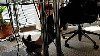Office worker engages in playful shoe activities during work hours.