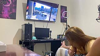 Sucking him quietly while he focuses on the video game.