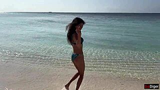 Crazy old man pisses on shocked girl at public beach, making her wet and squirting