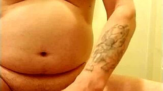 man practices self-pleasure with a ring on his member