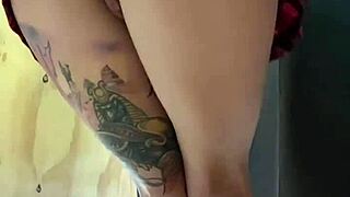 an unknown tattooed teen girl was recorded in a women's clothing store with a butt plug.