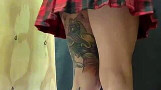 an unknown tattooed teen girl was recorded in a women's clothing store with a butt plug.